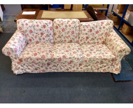 A modern IKEA three-seater sofa, floral upholstery