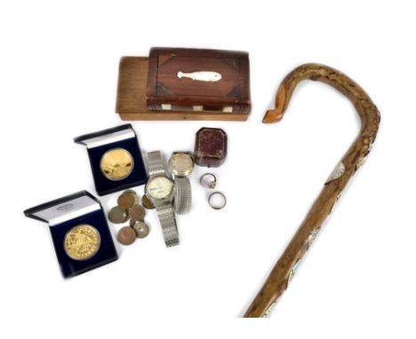 A prisoner of war wooden mystery box, shaped as a book with mother of pearl inserts, together with two silver rings, a rolled