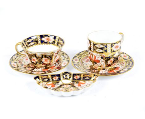 A collection of Royal Crown Derby Imari pattern porcelain, including ten saucers, two tea cups a coffee can, a sugar bowl, an