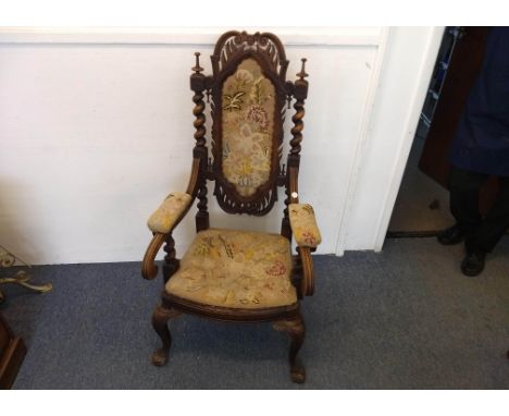 A 19th Century continental walnut arm chair, barley-twist columns flanking carved back, floral tapestry back, seat and arms, 