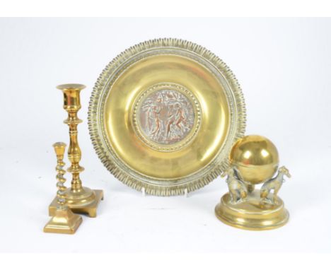 A Victorian brass inkwell, in the form of a hinged globe supported in the backs of three hounds, circular spreading base, 13 