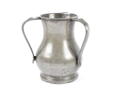 A three handled pewter tankard inscribed 'Echid Da I Lancia Eryri', marked 'London' next to a stamp of a rose, 20 cm high