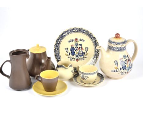 A 1960s Poole Pottery twin tone tea and coffee service in yellow and brown, including, teapot, coffee pot, chocolate pot, mil