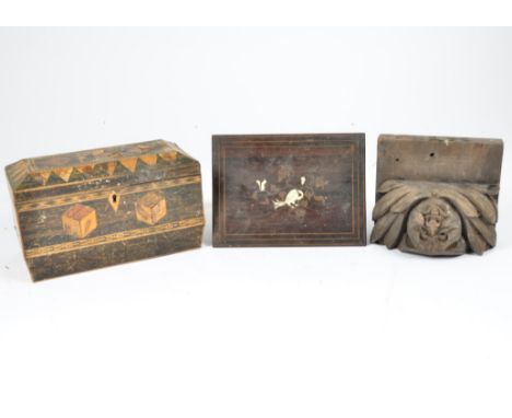 Two 20th Century wooden tea caddies, one decorated with marquetry inlay, the other in the sarcophagus form with ring handles,