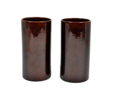 A pair of Tiffany &amp; Co vases, spherical in design with a red glaze inscribed 'Made to Commemorate the 75th anniversary of
