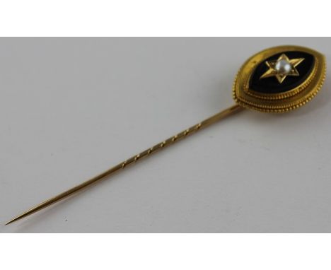 **REOFFER ETWALL JAN £60/£80**A Victorian yellow metal, jet and pearl mourning stick pin, the finial of concentric stepped na