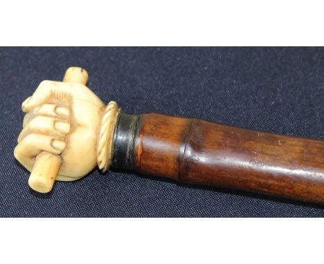 **REOFFER ETWALL JAN £100/£150**A 19th century bamboo cased sword stick, with carved ivory pommel in the form of an enclosed 