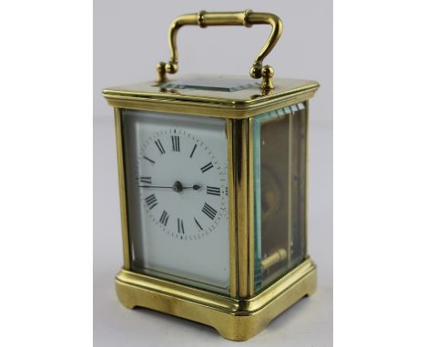 **REOFFER ETWALL JAN £30/£40**A brass carriage clock, of traditional rectangular form, with swing carry handle and white enam