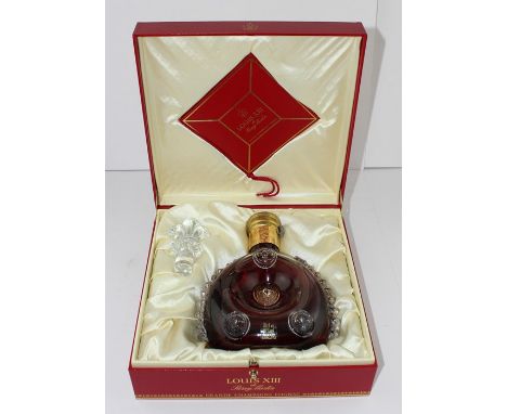 A boxed Remy Martin Louis X111 Grande Champagne Cognac, in Baccarat glass decanter and stopper.