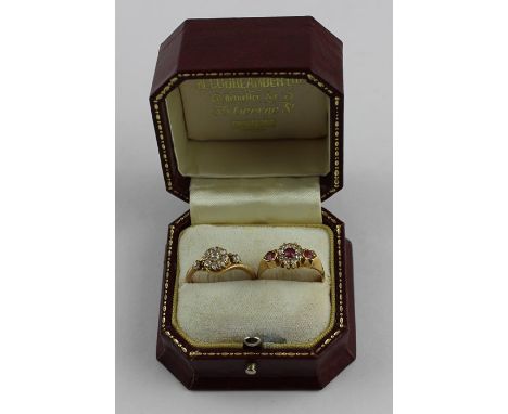 An 18ct. yellow gold, ruby and diamond ring, set round cut ruby to centre surrounded by ring of round old-cut diamonds and fu