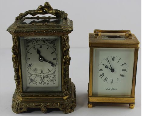 An engraved brass carriage clock, with single train movement and silvered dial, 21cm high inc. handle, together with a smalle