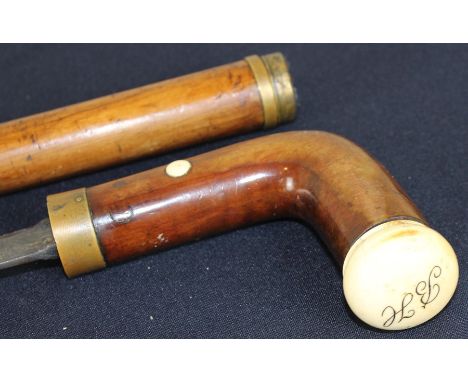 A 19th century sword stick, with brass mounts and ivory pommel initialled "BH", 92cm long.