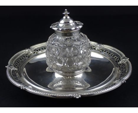 A Victorian silver mounted cut glass inkwell on stand, by Henry Wilkinson &amp; Co, assayed London 1869, of circular form, th