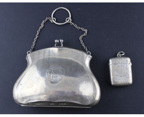 A silver purse, by T H Hazlewood &amp; Co, assayed Birmingham 1917, fashioned as a clutch handbag, the shaped sides with band