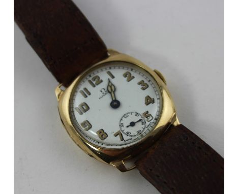 A 9ct. gold Omega wrist watch, c.1930's, mechanical wind, having circular white enamel Arabic numeral dial and subsidiary sec