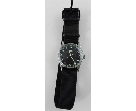 A stainless steel Omega military wrist watch, manual movement, black circular Arabic numeral dial with luminous hands and dot