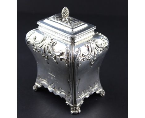 A George III silver tea caddy, by Pierre Gillois, assayed London 1764, of rectangular bombe form, having repousse foliate scr