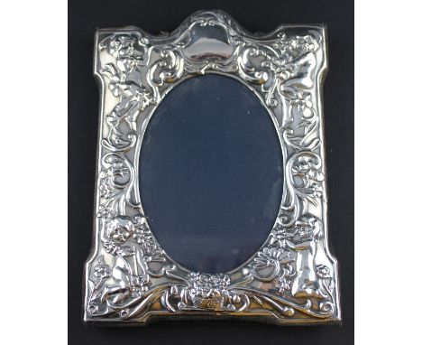A silver photograph frame, by Whitehill Silver, assayed Sheffield 1990, of rectangular form with felt covered easel back, the