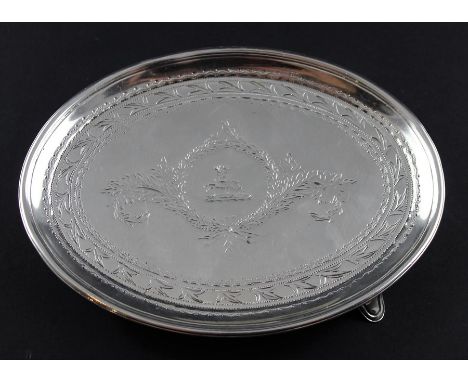 A George III silver card tray or teapot stand, by George Burrows I, assayed London 1799, of oval form, with engraved decorati