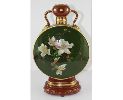 A Minton pottery moon flask, painted with flowers and butterfly by Richard Pilsbury on a green ground, the neck, base and sid