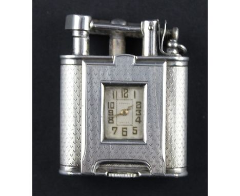 An Art Deco Alfred Dunhill &amp; Sons "Unique" silver lift arm table cigarette lighter, of rectangular form with curved ends 