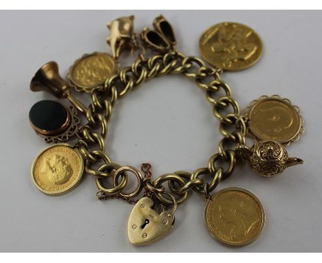 A 9ct. gold heavy curb link charm bracelet, the bracelet with each link impressed "375" and "9", with 9ct. gold hallmarked he