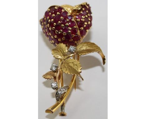 A yellow metal, ruby and diamond "rose flower" brooch, fashioned as a single opening rose flower to stem with petiole and lea