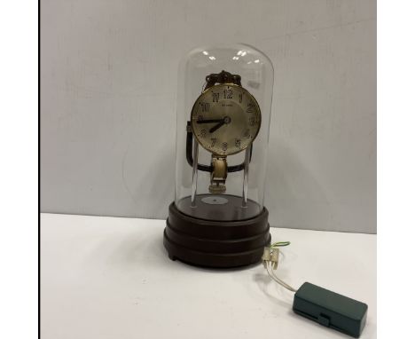A French Bulle electric clock complete with original glass dome and bakelite base, 27.5 cm high