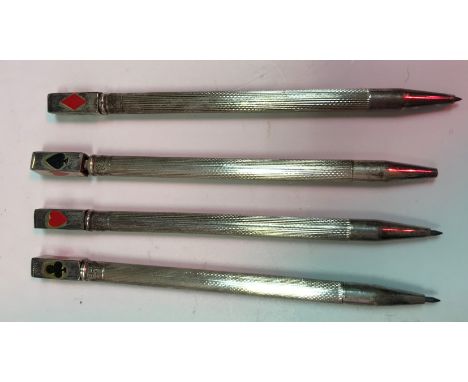 A set of four sterling silver Bridge pencils each depicting one of the four suits, a silver bookmark in the form of an owl, a