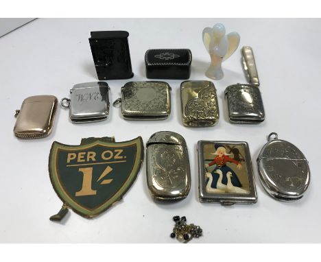 A silver vesta case, together with various silver plated vesta cases, a vaseline glass angel ornament, a silver bladed mother
