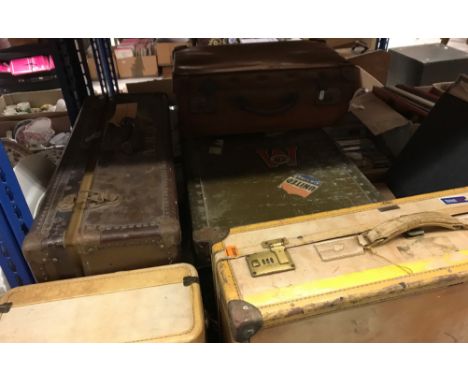 A Hartmann custom crafted simulated vellum suitcase and Excelsior studded suitcase, school type studded trunk and another sui