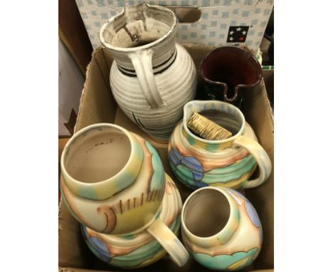 Two boxes of various Studio pottery to include Carltonware floral decorated jugs and vases, a Coldstone kiln pottery brown an