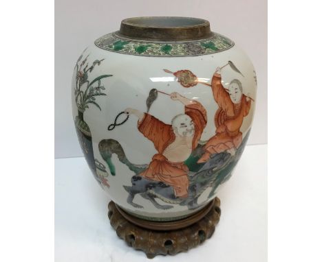 A Chinese Kangxi palette jar depicting five various figures riding upon the backs of kylin with vases of prunus blossom and f