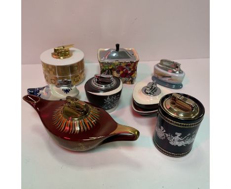 A collection of various table lighters including a Carlton ware rouge royale oil lamp table lighter, a Rosenthal Studio Linie