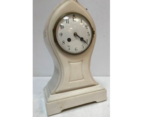 A 19th Century French white marble cased mantel clock of lancet form, the eight-day movement with enamelled dial and Arabic n