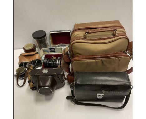 A collection of various mid 20th Century photographic equipment to include Miranda camera, Olympus Pen EE3 camera, various ac