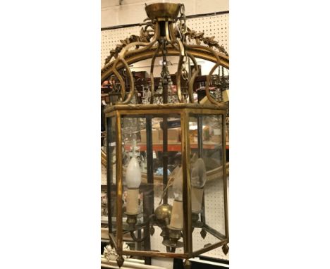 A pair of 20th Century hexagonal brass framed and glazed three light hall lanterns in the Georgian style, 27 cm diameter x 52