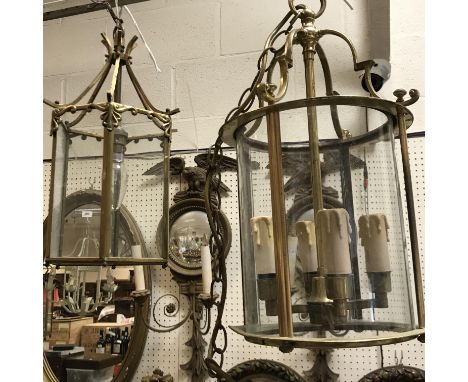 A 20th Century brass framed cylindrical ceiling lantern in the Georgian style with four internal candle type lights, 24 cm di