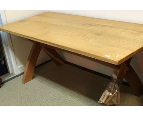 A light oak refectory style dining table in the Arts &amp; Crafts taste, the four plank top on shaped X trestle end supports 