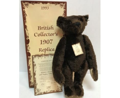 A Steiff 1907 replica teddy bear, limited edition of 3000, produced 1993 with button in ear and dark brown plush, boxed