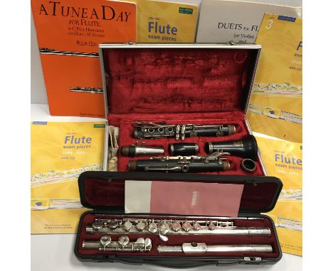 A Yamaha silver plated flute No. 211SII in case and a Boosey &amp; Hawkes Emperor clarinet in case together with four flute b