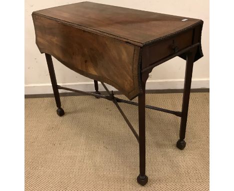 A circa 1800 mahogany and inlaid and cross-banded Pembroke table in the Chippendale taste, the shaped rectangular top with dr