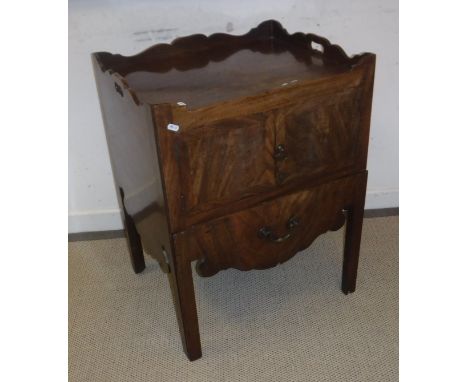 A George III mahogany night table, the tray top above two cupboard doors and pull-out section (with alterations), 58 cm wide 