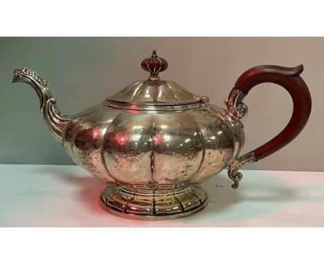 A Birks sterling silver teapot in the form a squash with wooden handle and finial, 23 oz