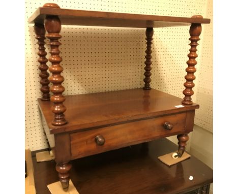 A Victorian mahogany whatnot of two tiers on bobbin turned supports with single drawer on turned legs to brass caps and caste
