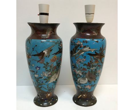 A pair of circa 1900 Chinese cloisonne vases decorated with birds and butterflies amongst blossoming foliage, 31 cm not inclu