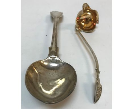A Victorian silver basting spoon (London 1842, bearing two maker's marks SM, the other indistinct) 29.6 cm long, together wit