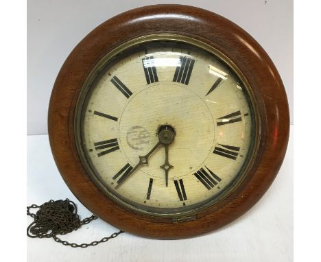A Victorian postman's alarm clock with mahogany surround and painted dial with Roman numerals, 32 cm diameter