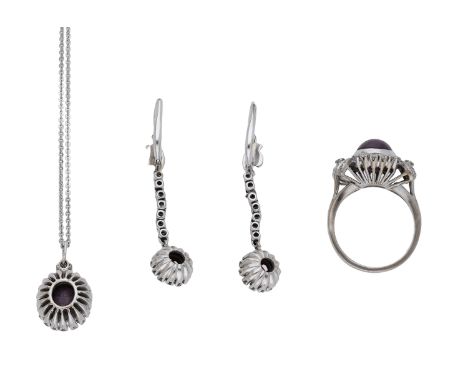 A star ruby and diamond suite, comprising a necklace, ring and pendent earrings, each set with a star ruby cabochon within a 