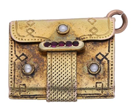 A Victorian gold novelty book locket, realistically modelled and opening to reveal two frames, with garnet cabochon and half-